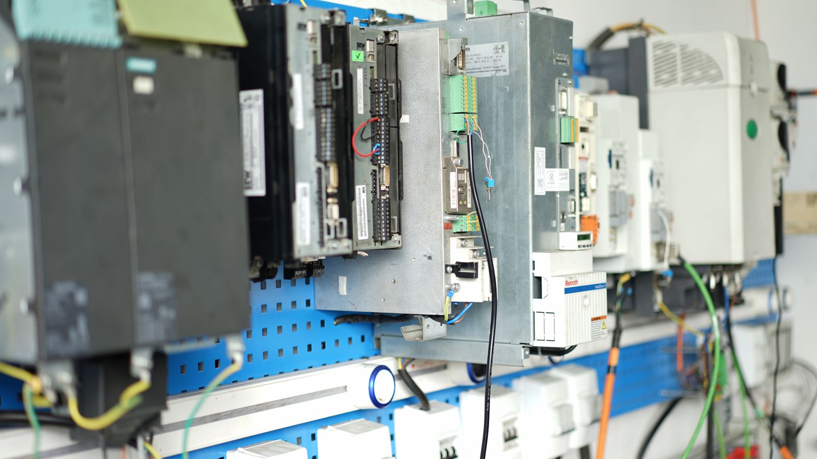 Servo drive on a test bench; power and control connections visible.