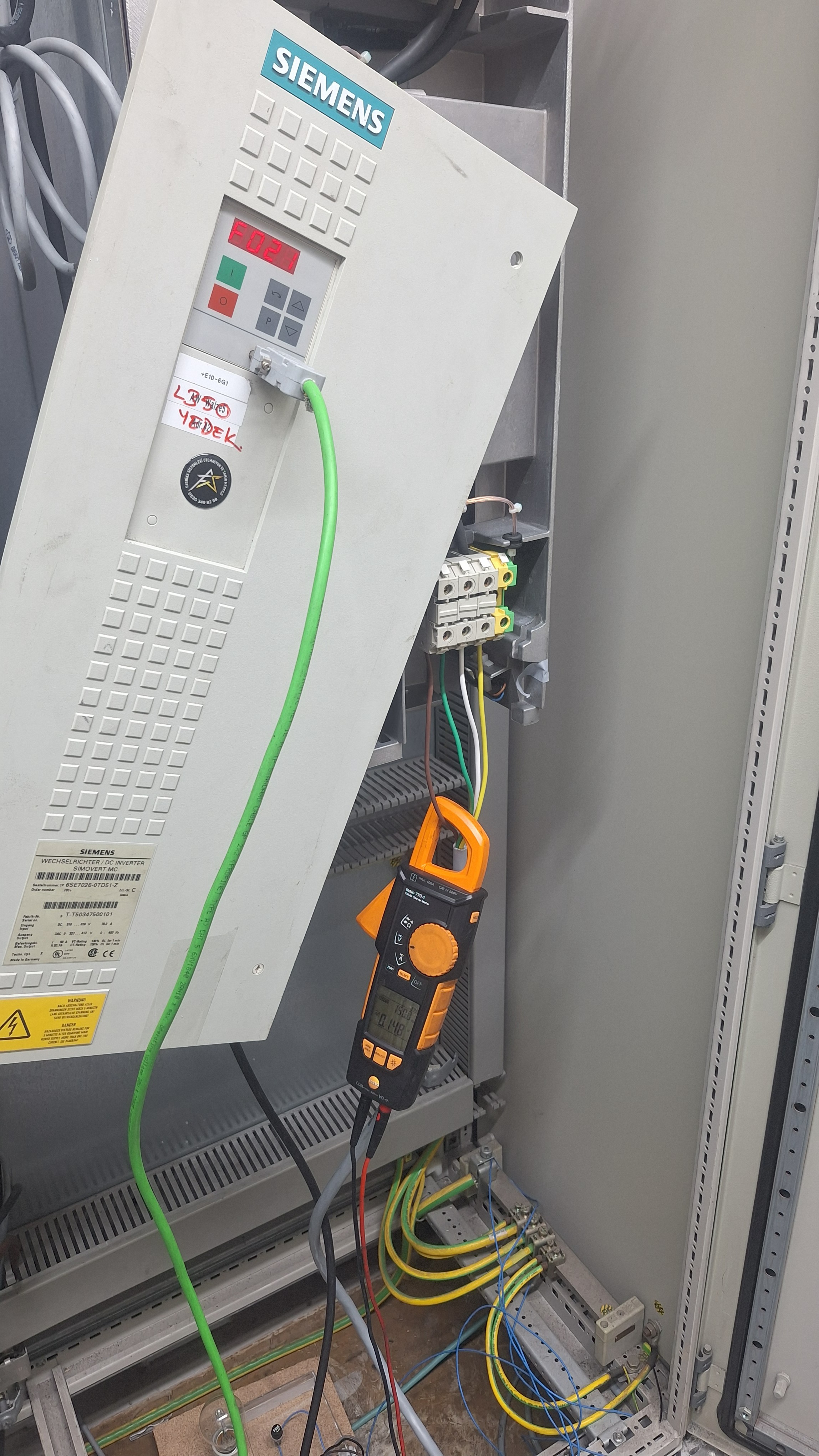 Cable and terminal check inside a control panel.